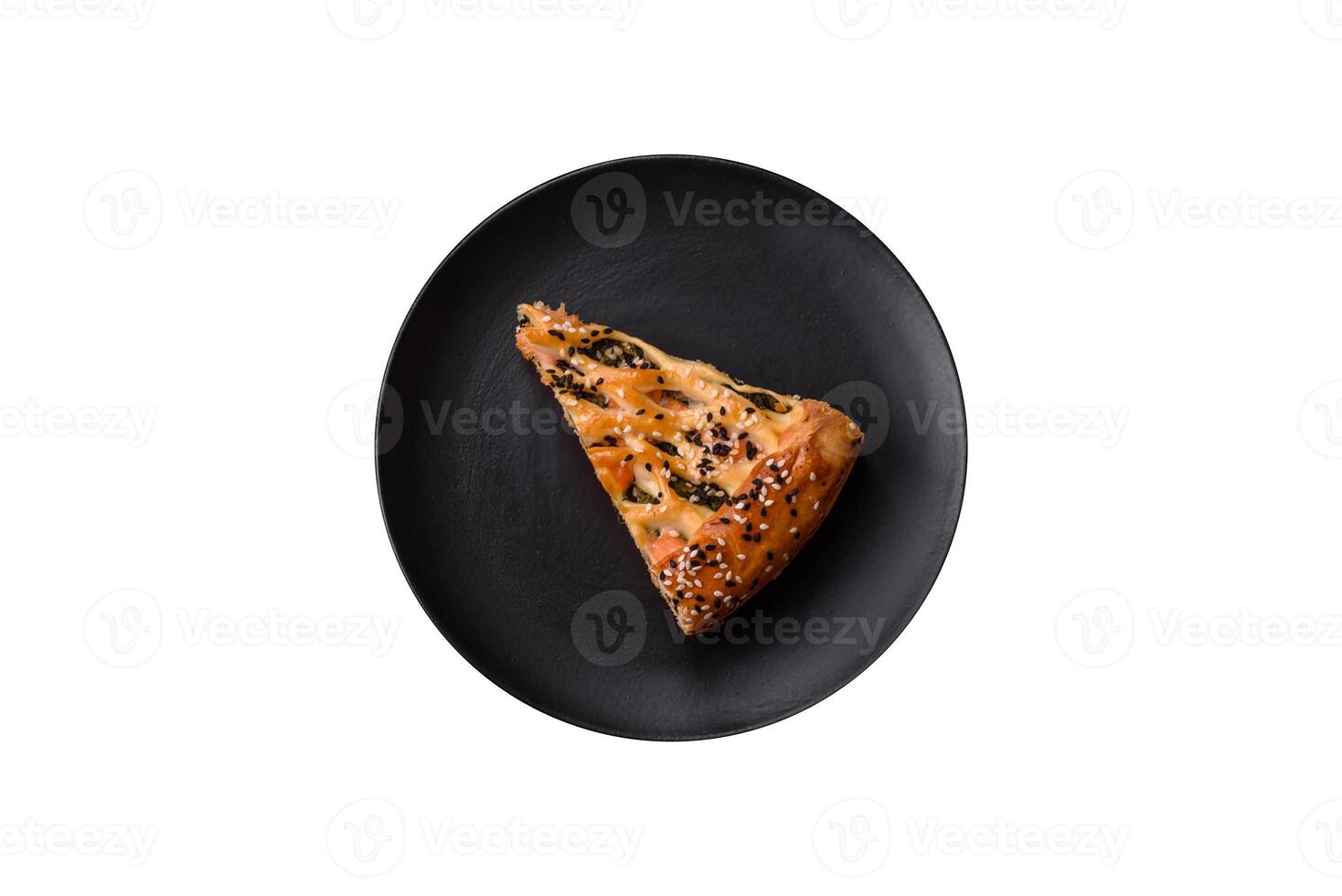 Pieces of quiche with salmon, spinach or broccoli, salt and spices photo