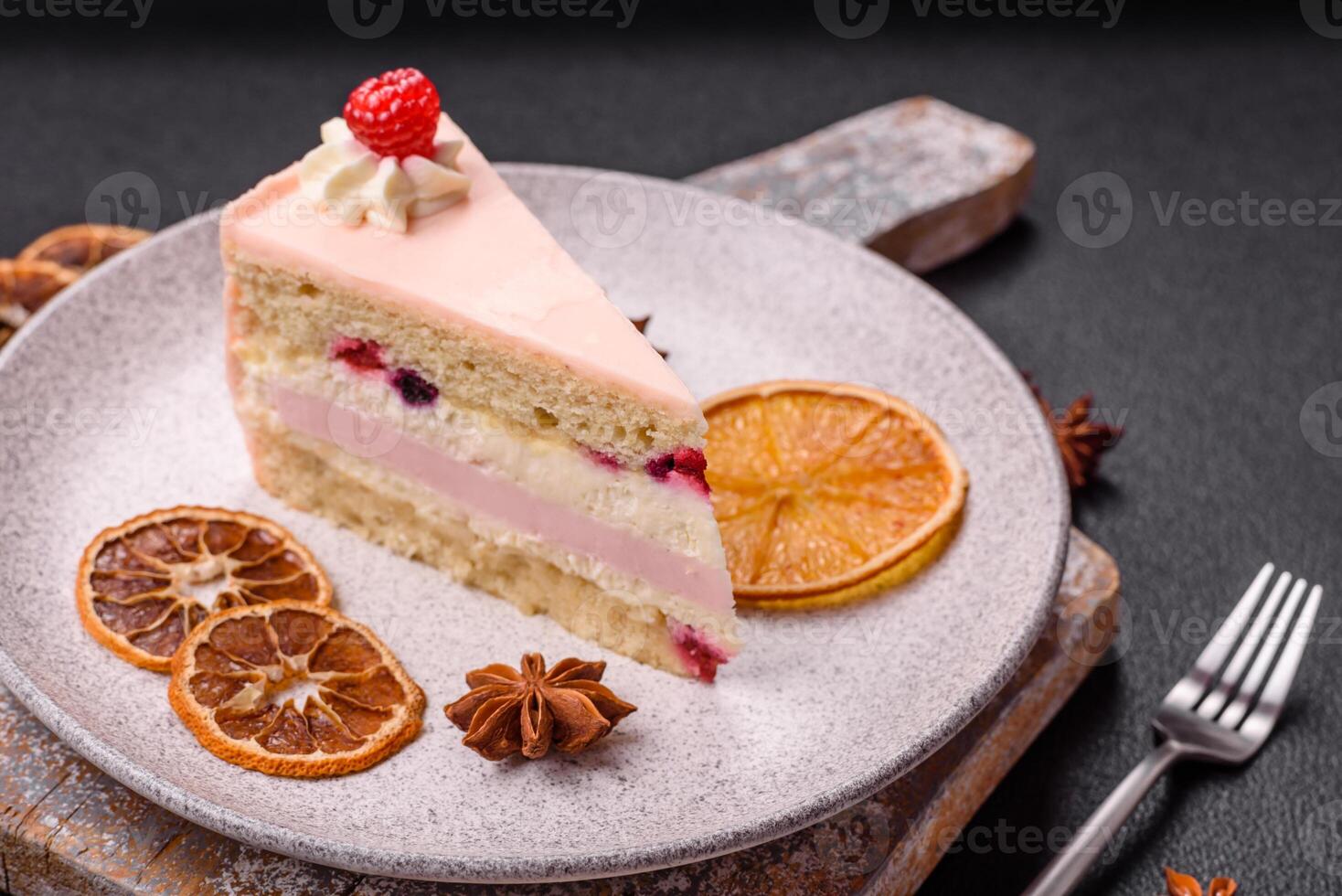 Piece of sweet cake with pink cream with raspberry flavor, with shortbread, cheesecake photo