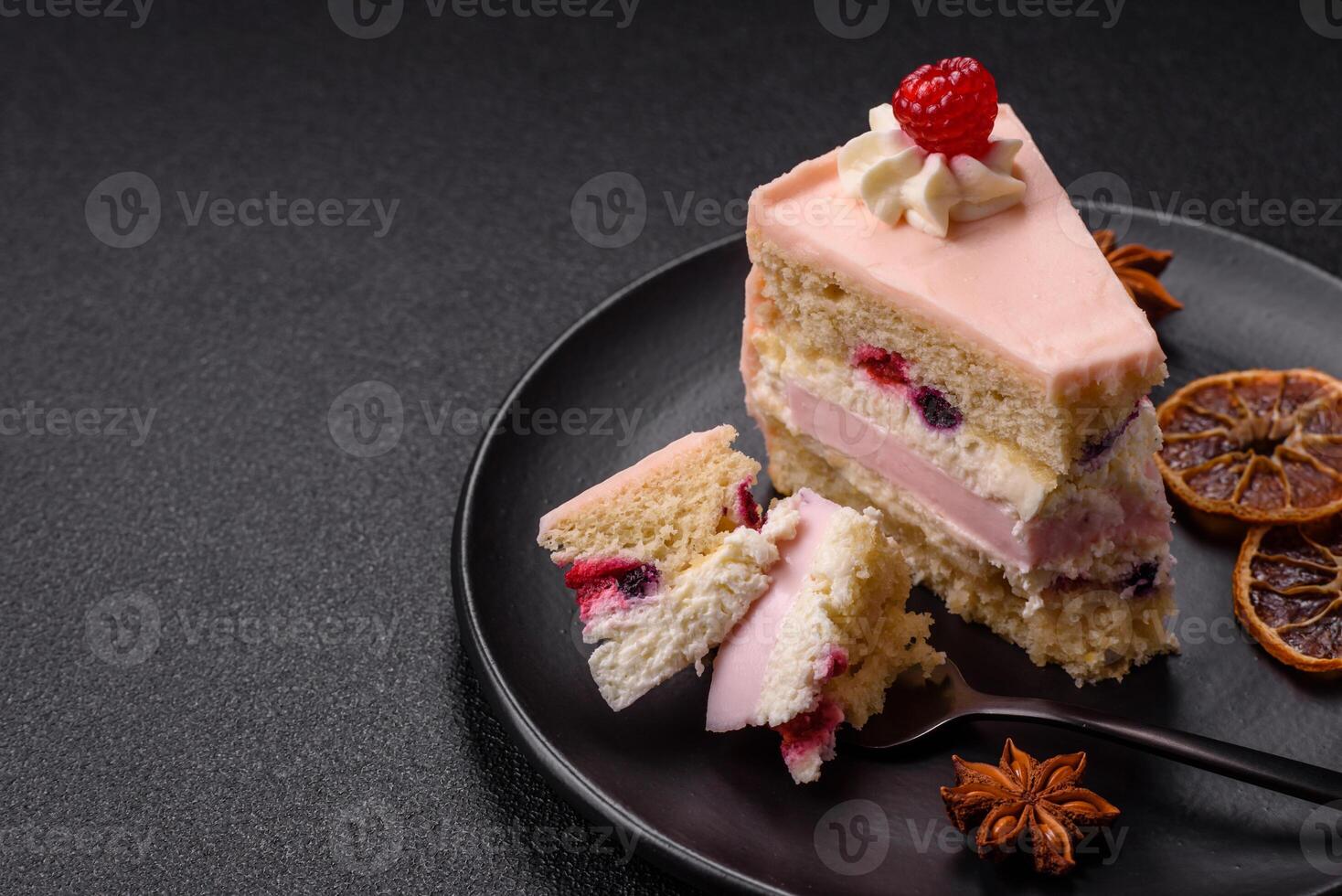 Piece of sweet cake with pink cream with raspberry flavor, with shortbread, cheesecake photo