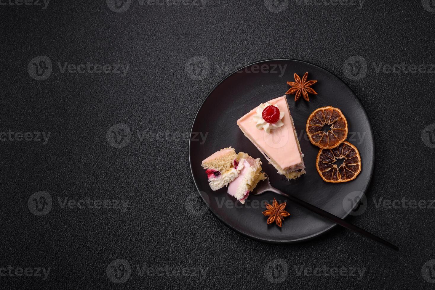 Piece of sweet cake with pink cream with raspberry flavor, with shortbread, cheesecake photo