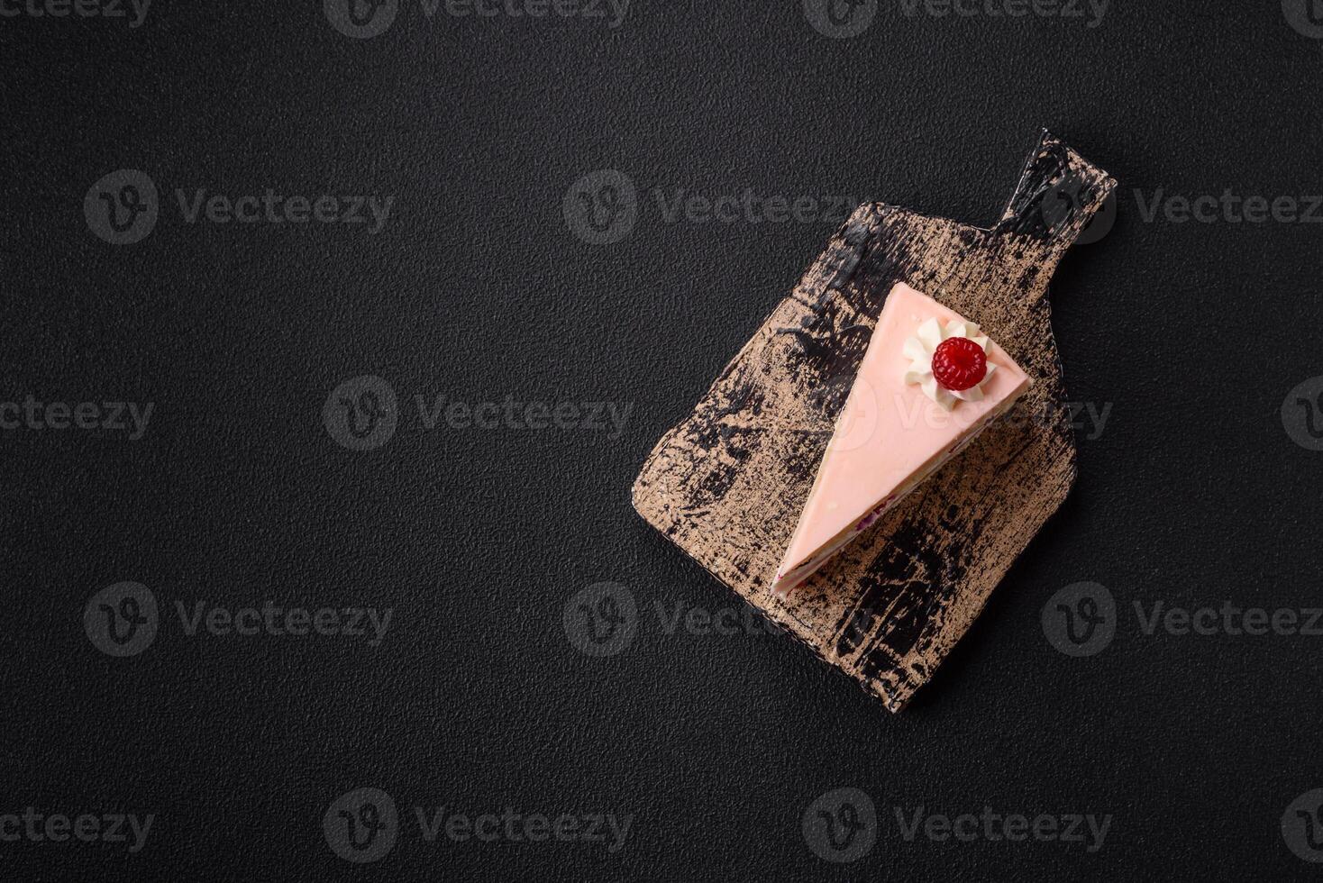 Piece of sweet cake with pink cream with raspberry flavor, with shortbread, cheesecake photo