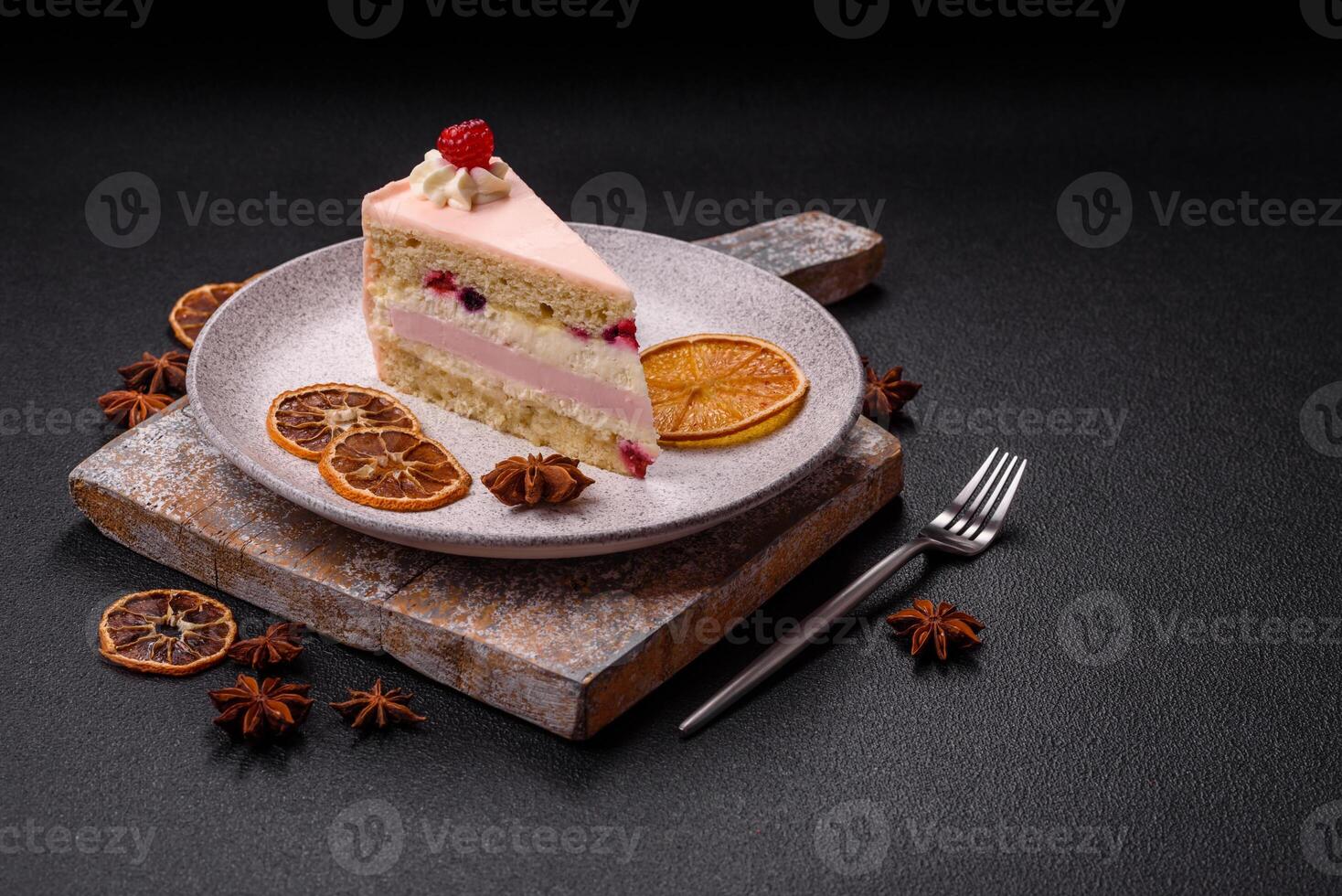 Piece of sweet cake with pink cream with raspberry flavor, with shortbread, cheesecake photo