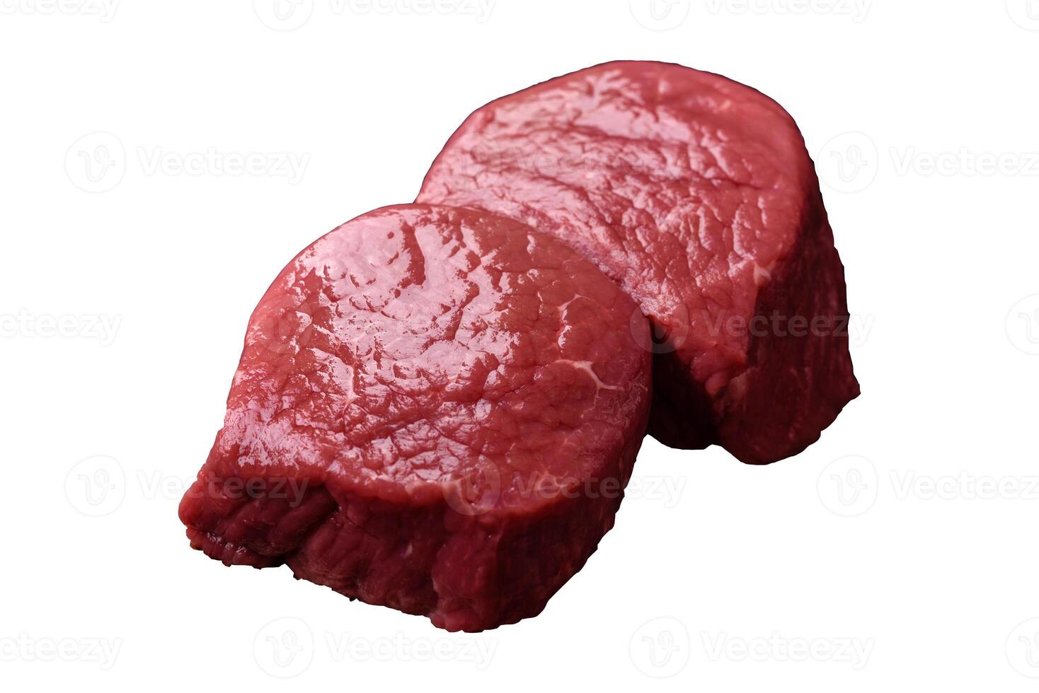 Raw beef eye steak round with salt, spices and herbs photo