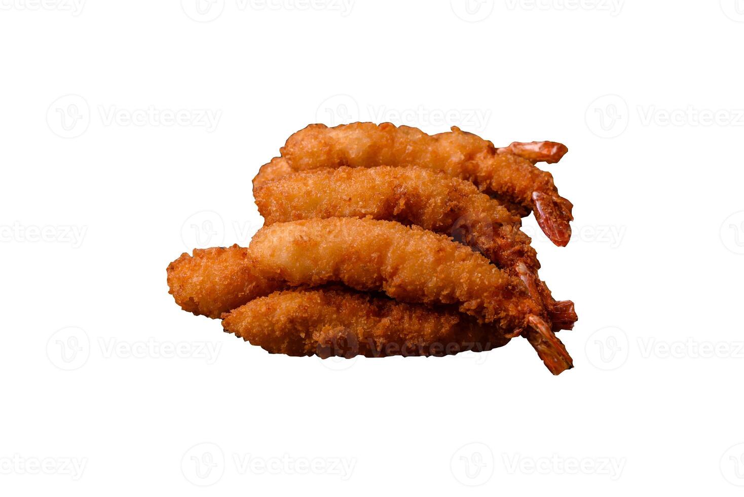Hot crispy shrimp breaded with salt and spices with white sauce photo
