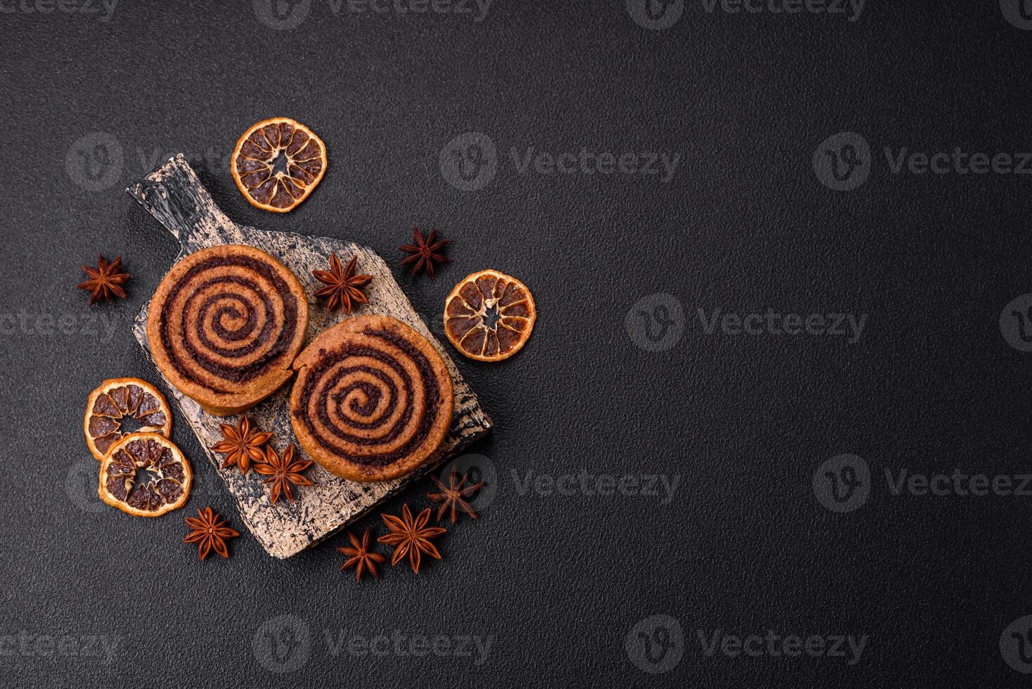 Freshly baked cinnamon roll with spices and cocoa filling photo