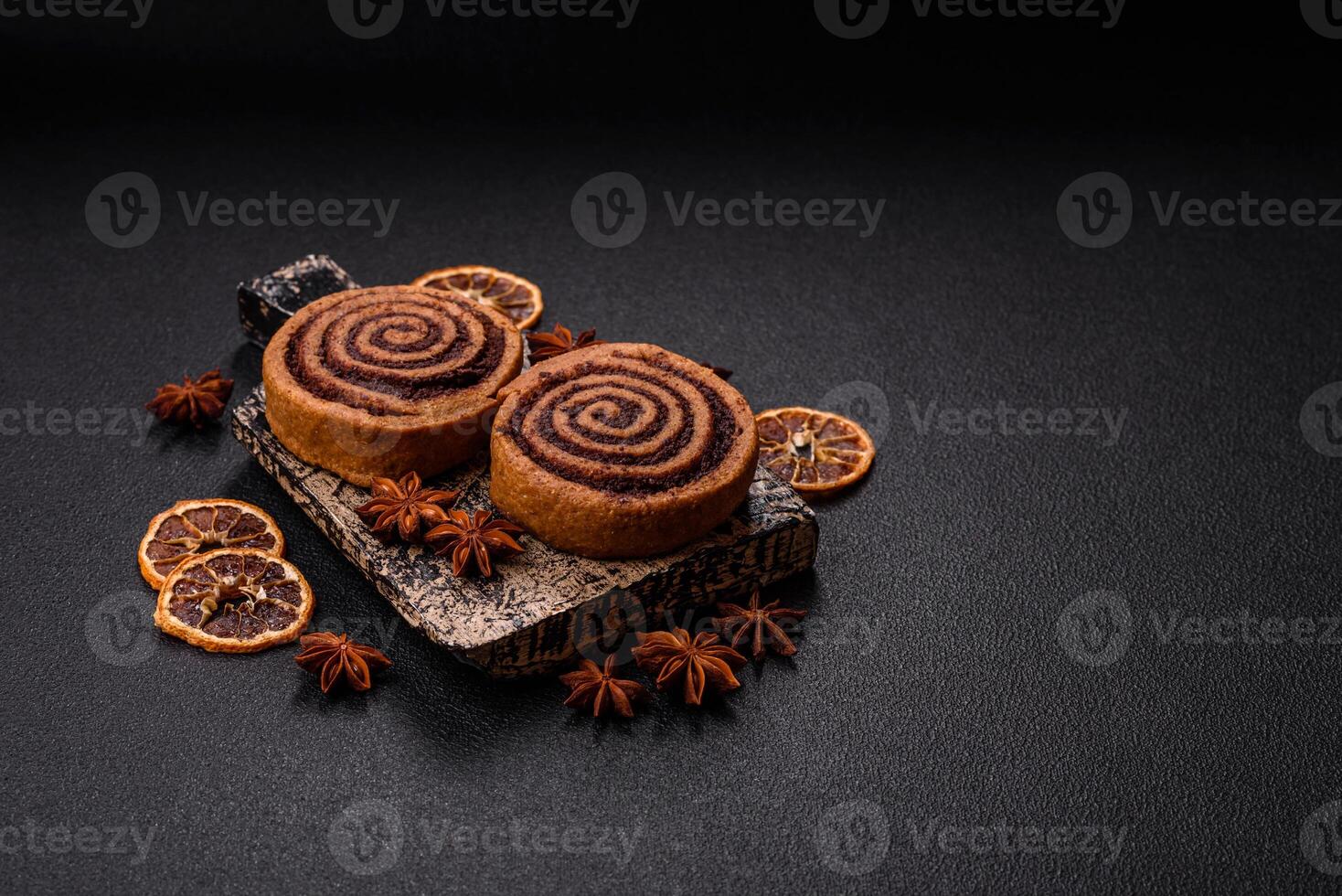 Freshly baked cinnamon roll with spices and cocoa filling photo