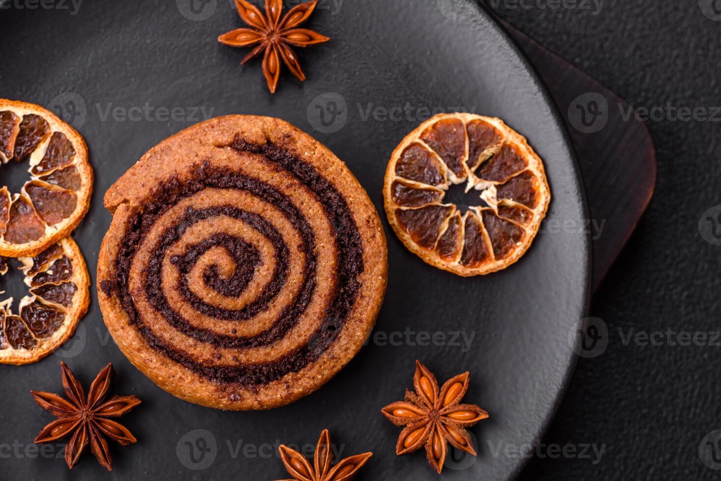 Freshly baked cinnamon roll with spices and cocoa filling photo