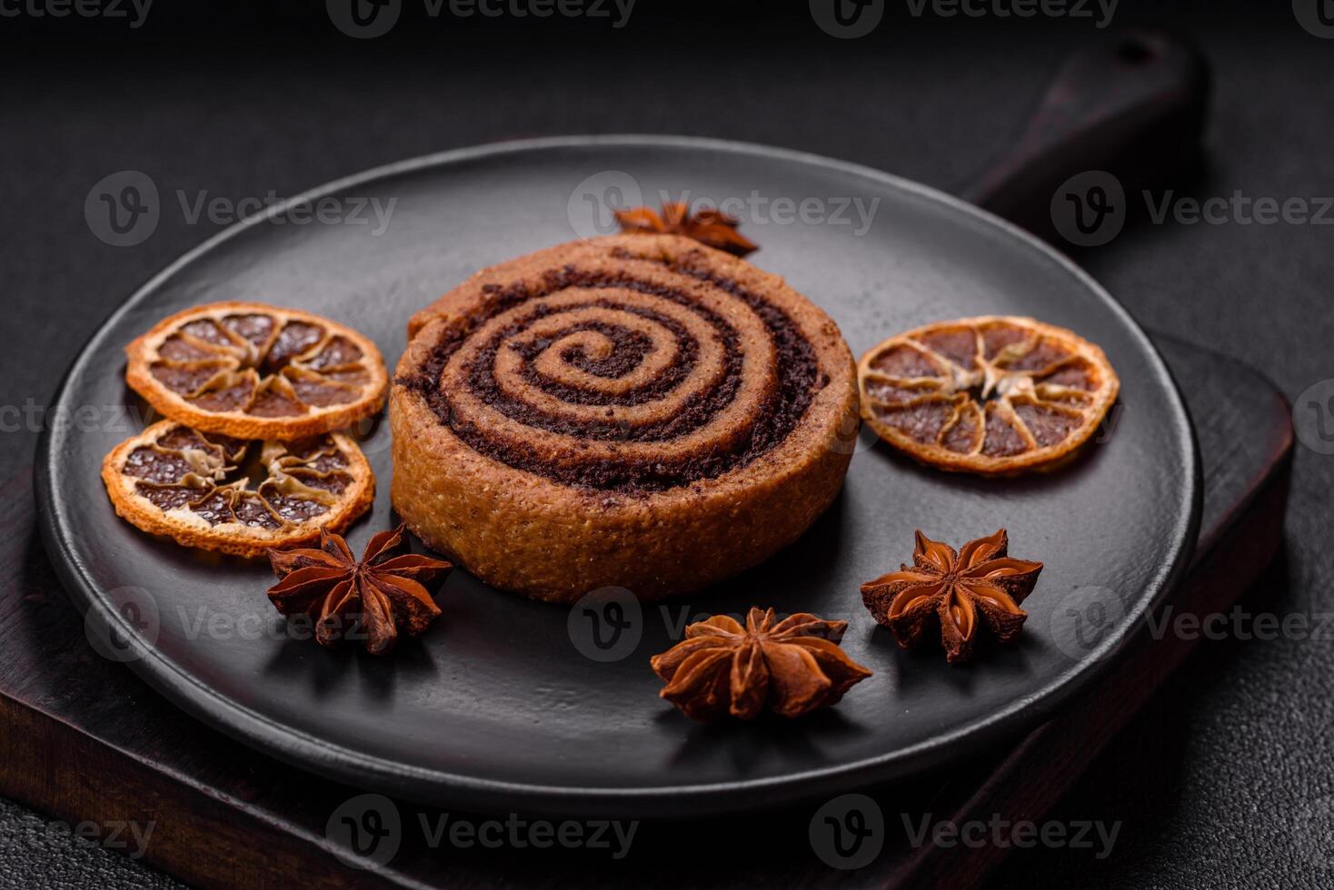 Freshly baked cinnamon roll with spices and cocoa filling photo