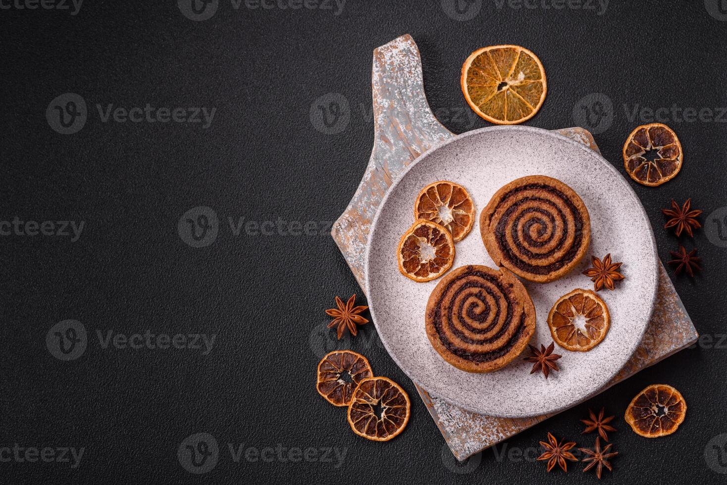 Freshly baked cinnamon roll with spices and cocoa filling photo