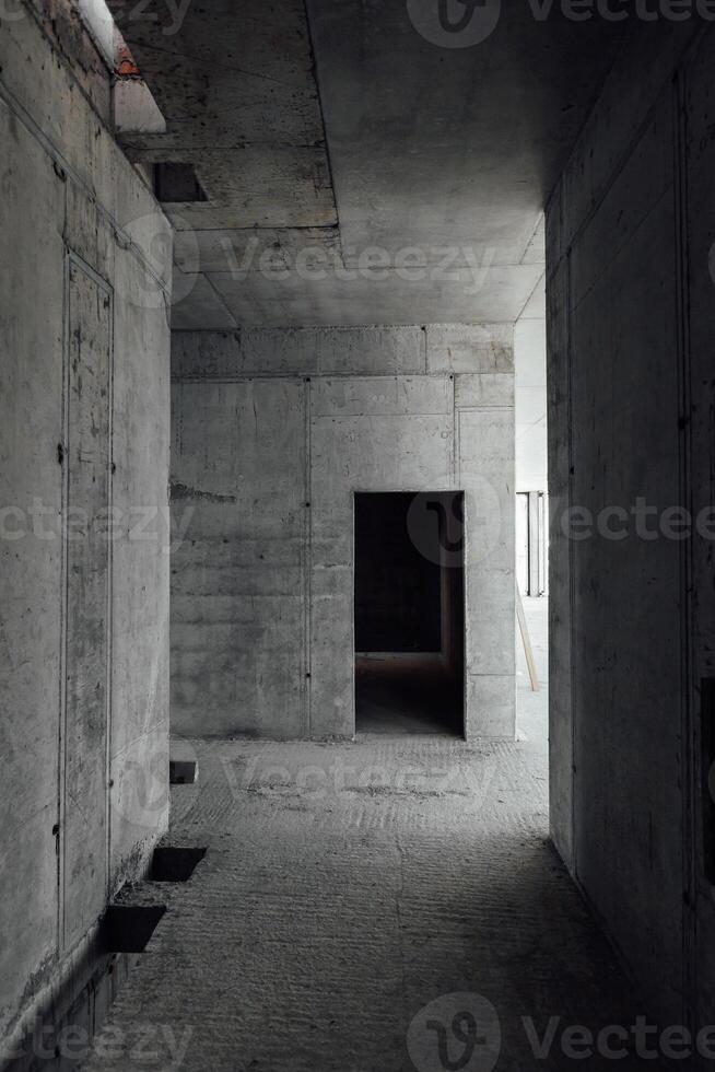 Concrete walls of the interiors in the building under construction photo