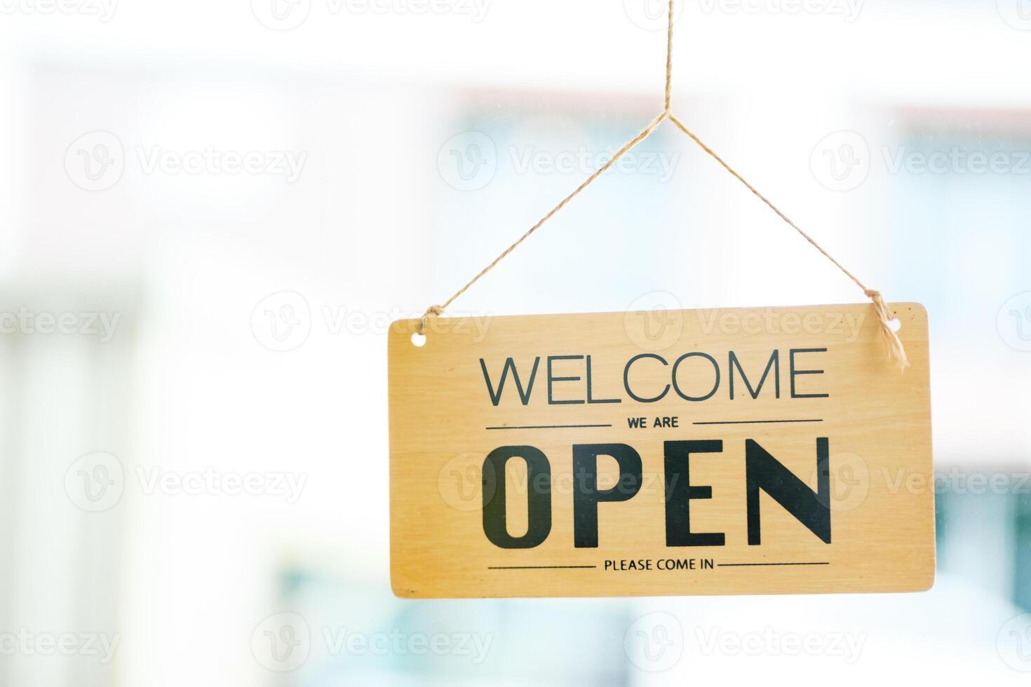 Open sign welcoming customers, symbolizing the beginning of a new business day. photo