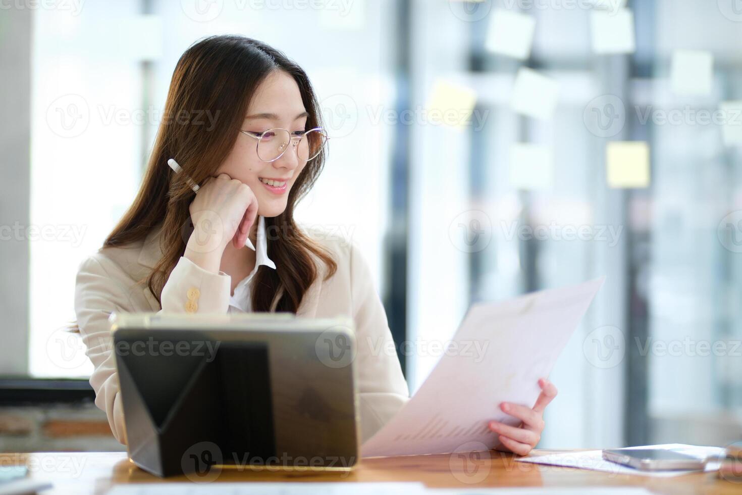 Businesswoman and entrepreneur using a tablet for data analysis and investment planning photo