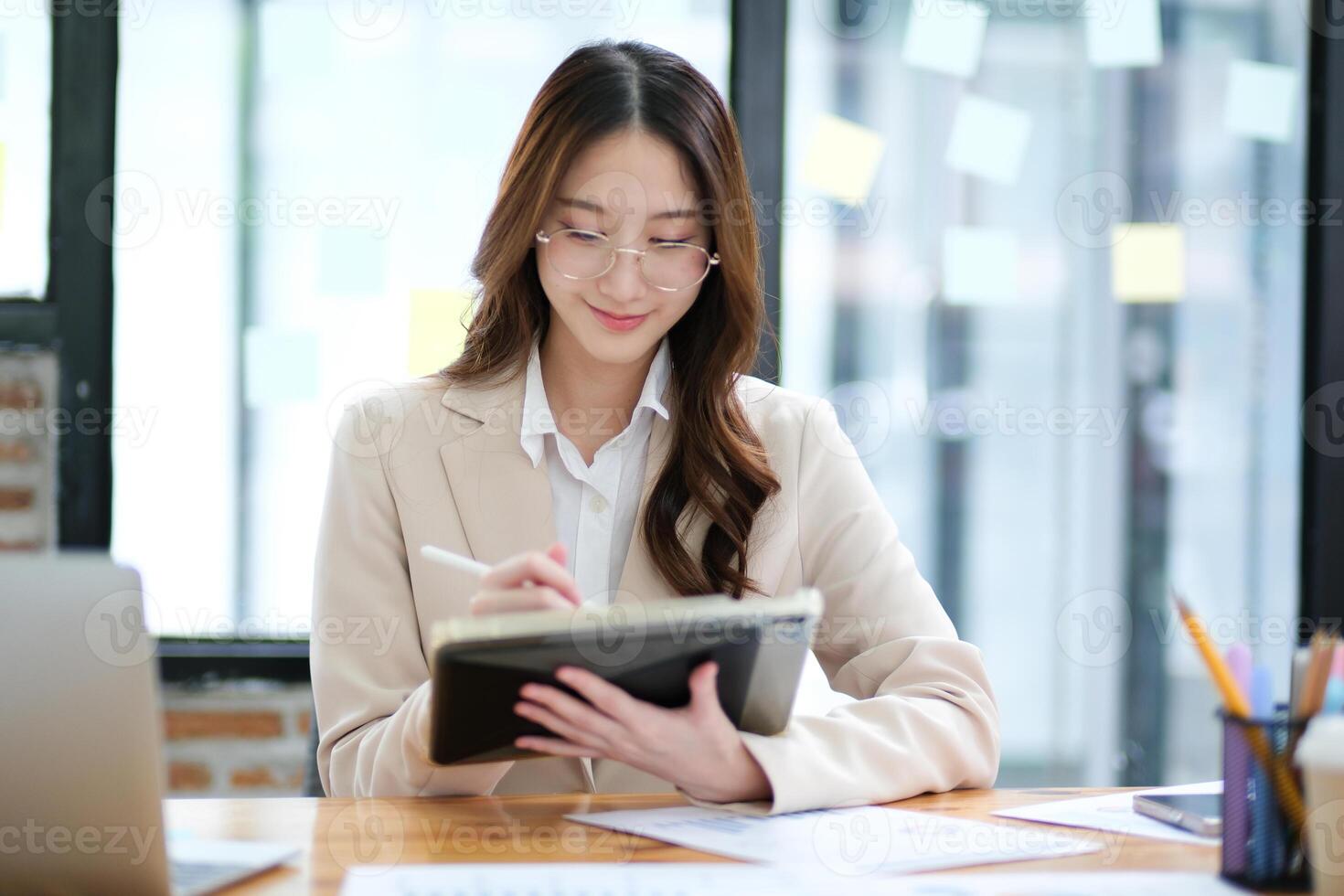 Businesswoman and entrepreneur using a tablet for data analysis and investment planning photo