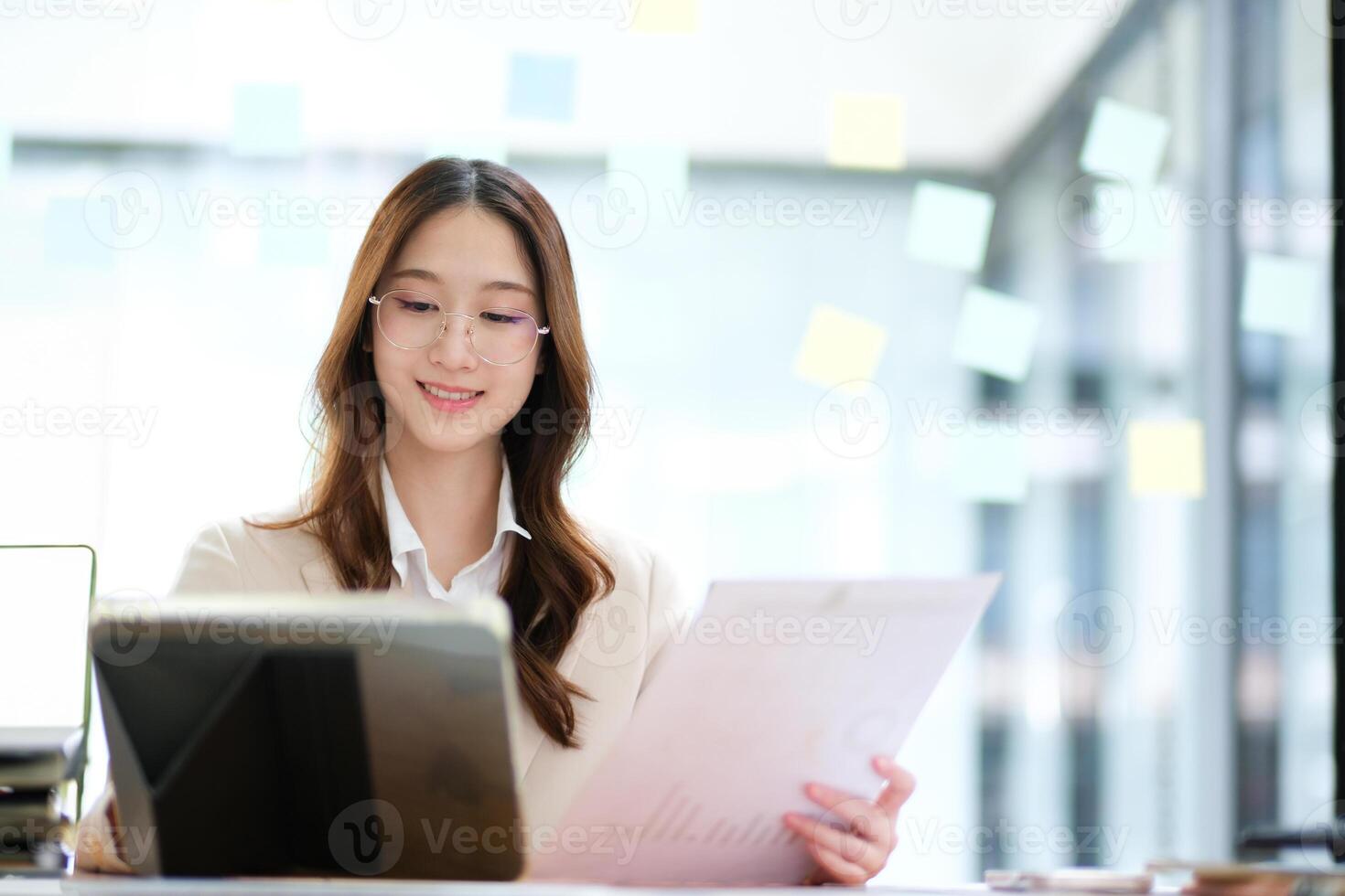 Businesswoman and entrepreneur using a tablet for data analysis and investment planning photo
