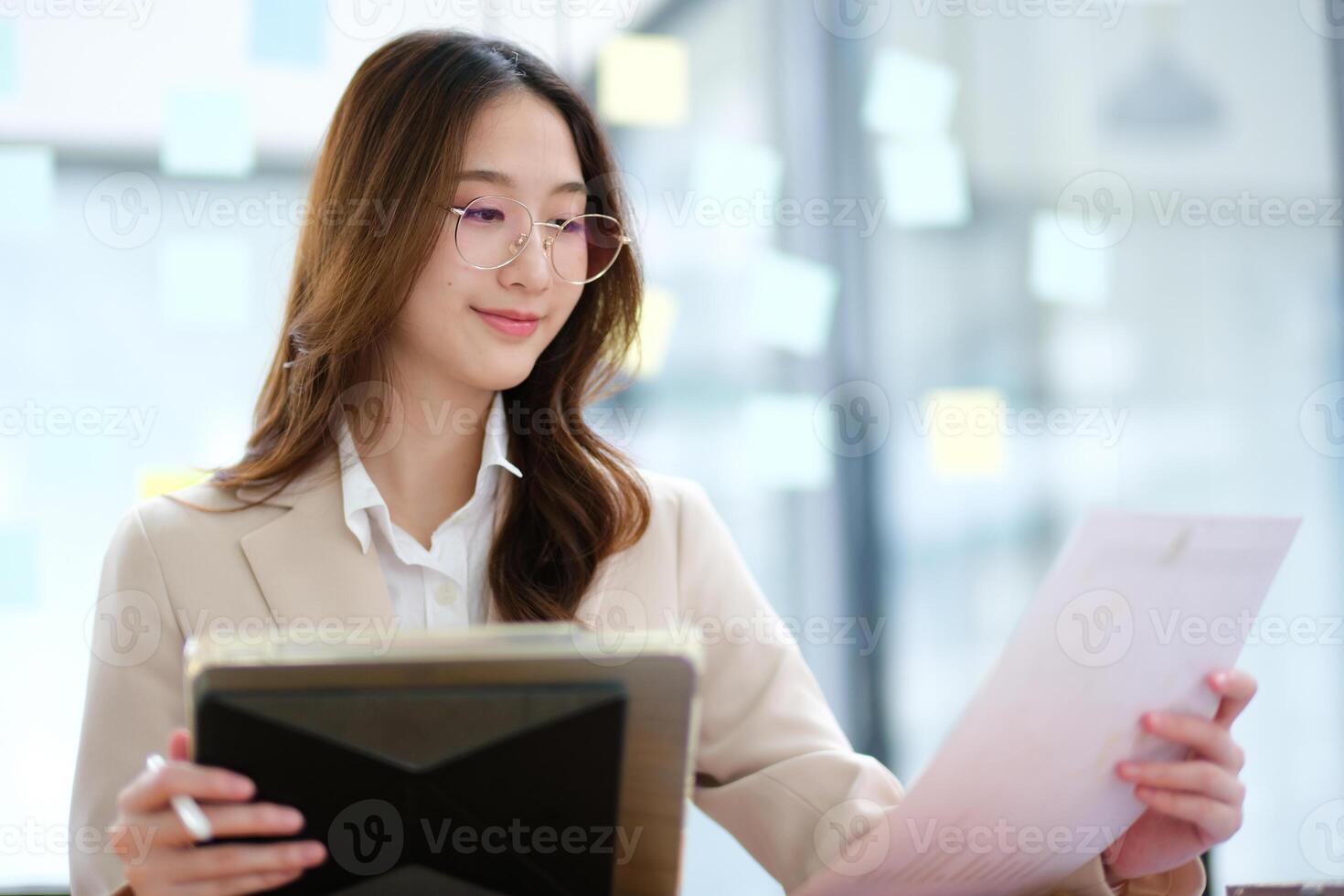 Businesswoman and entrepreneur using a tablet for data analysis and investment planning photo
