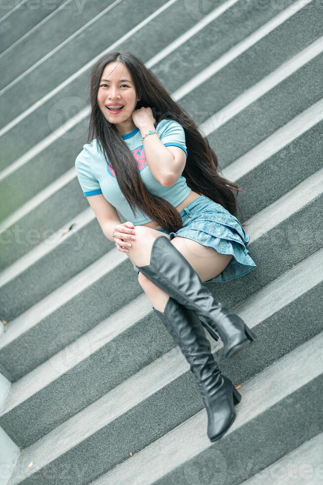 A woman sitting on some steps photo