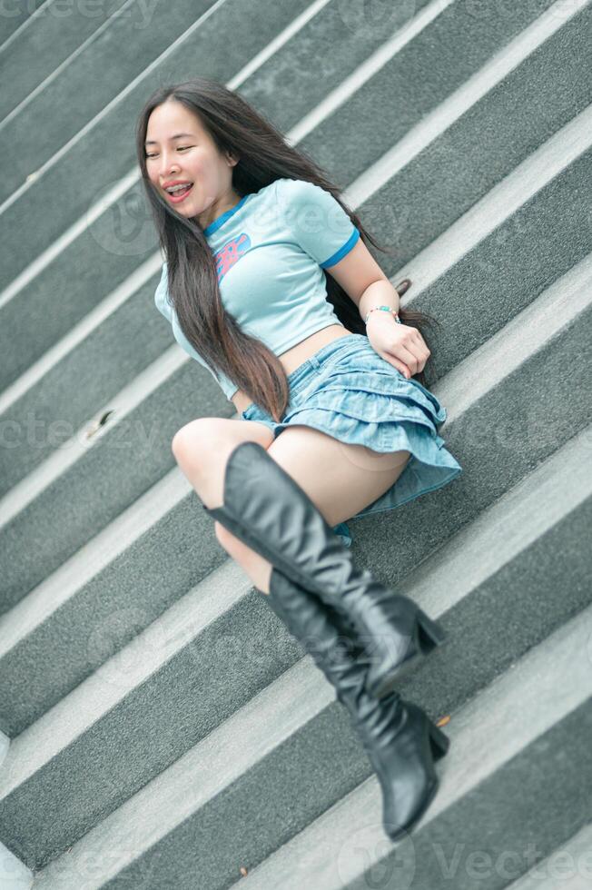 A woman sitting on some steps photo