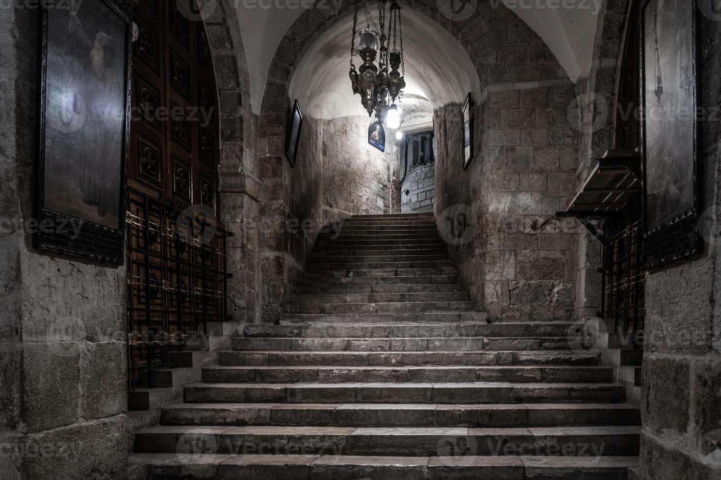 Dark staircase leading to the basement of the historic Church of the Holy Sepulchre in Jerusalem photo