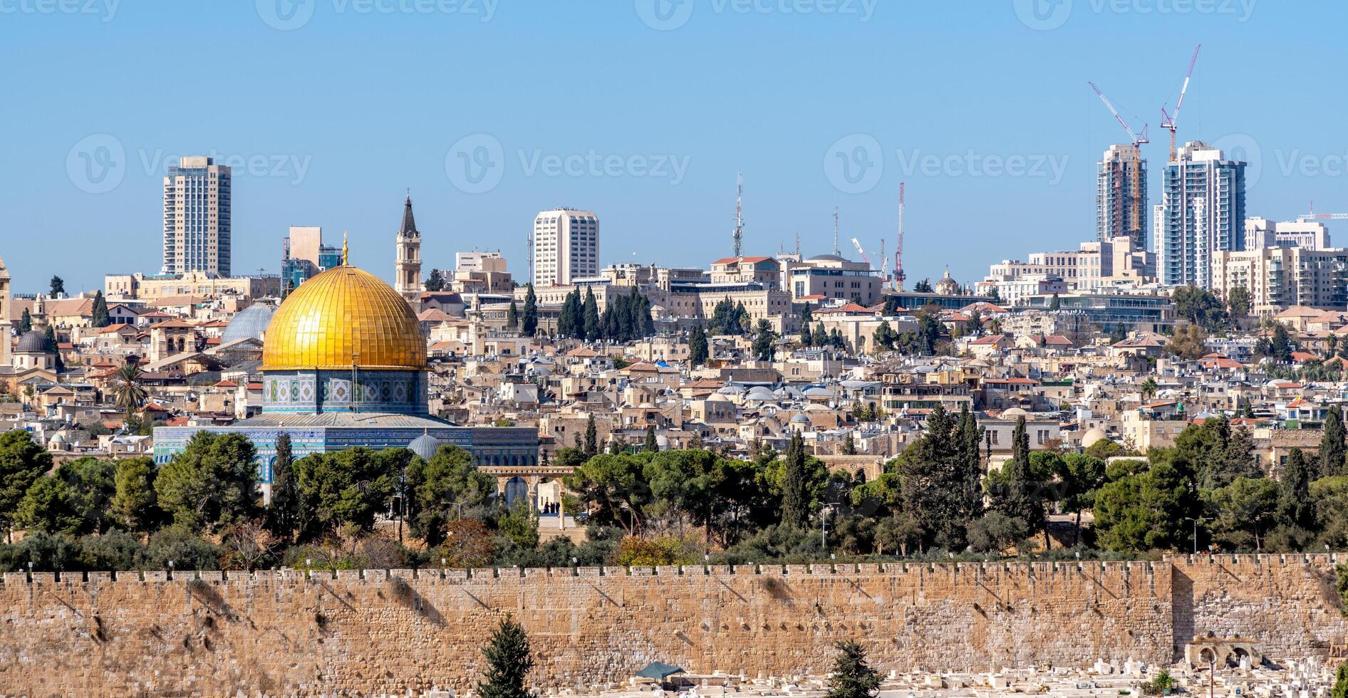Temple Mount with the golden dome of the Al Aqsa Mosque and the Jerusalem skyline photo
