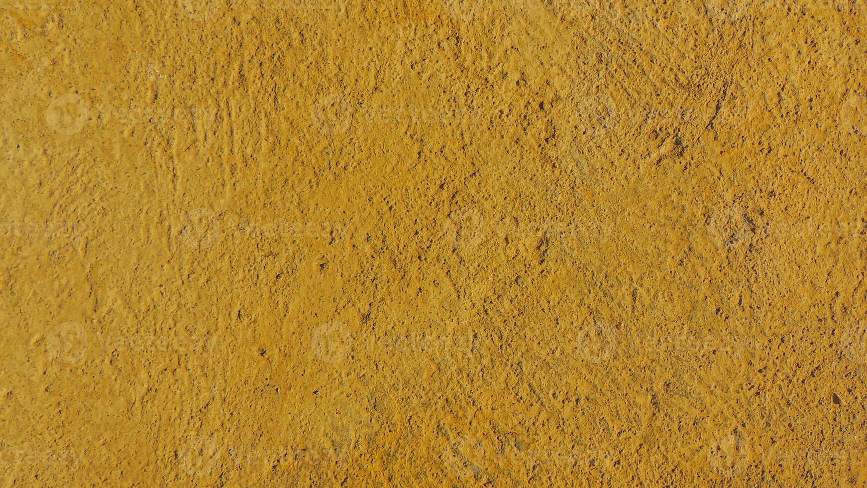 A yellow wall with a brown stain photo