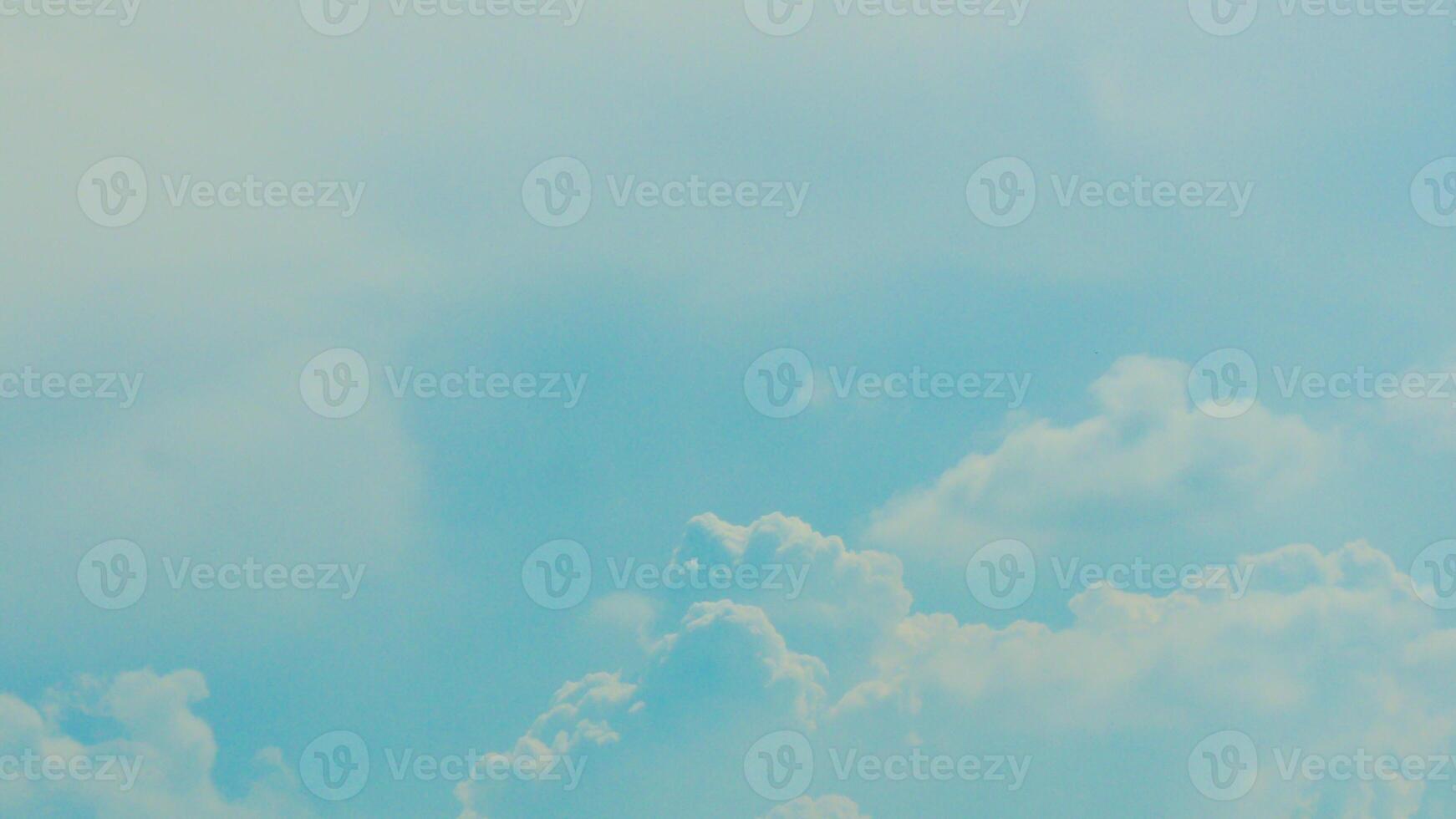 A plane flying in the sky with a cloud in the background photo