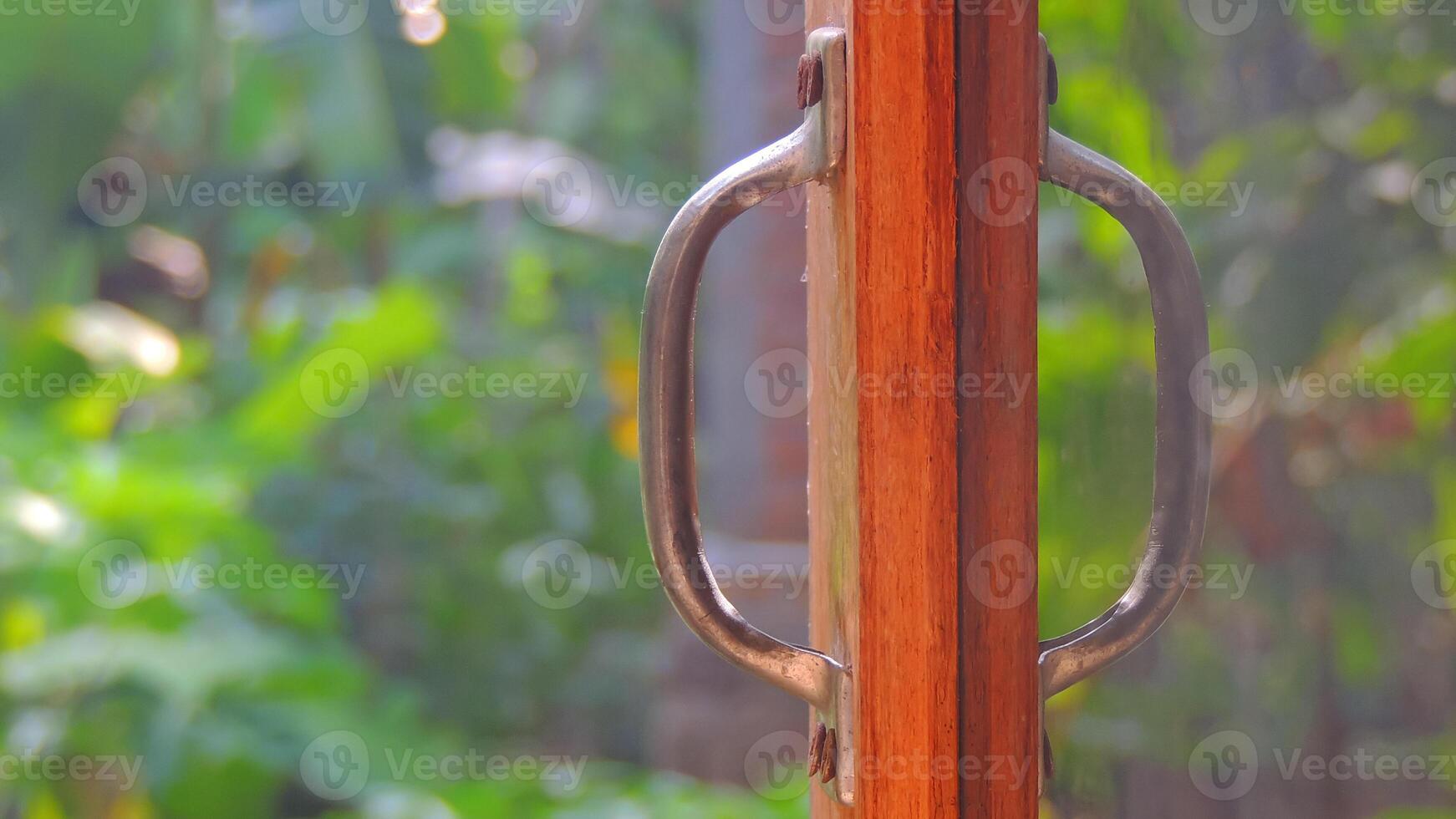 A wooden door handle with a metal handle photo