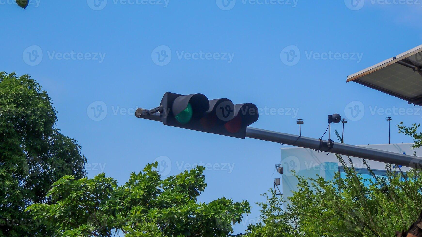 A traffic light with a green light and a red light photo
