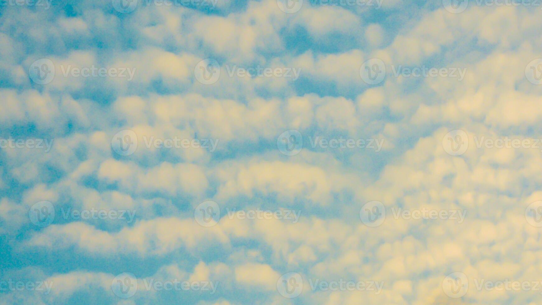 A plane flying through the clouds photo