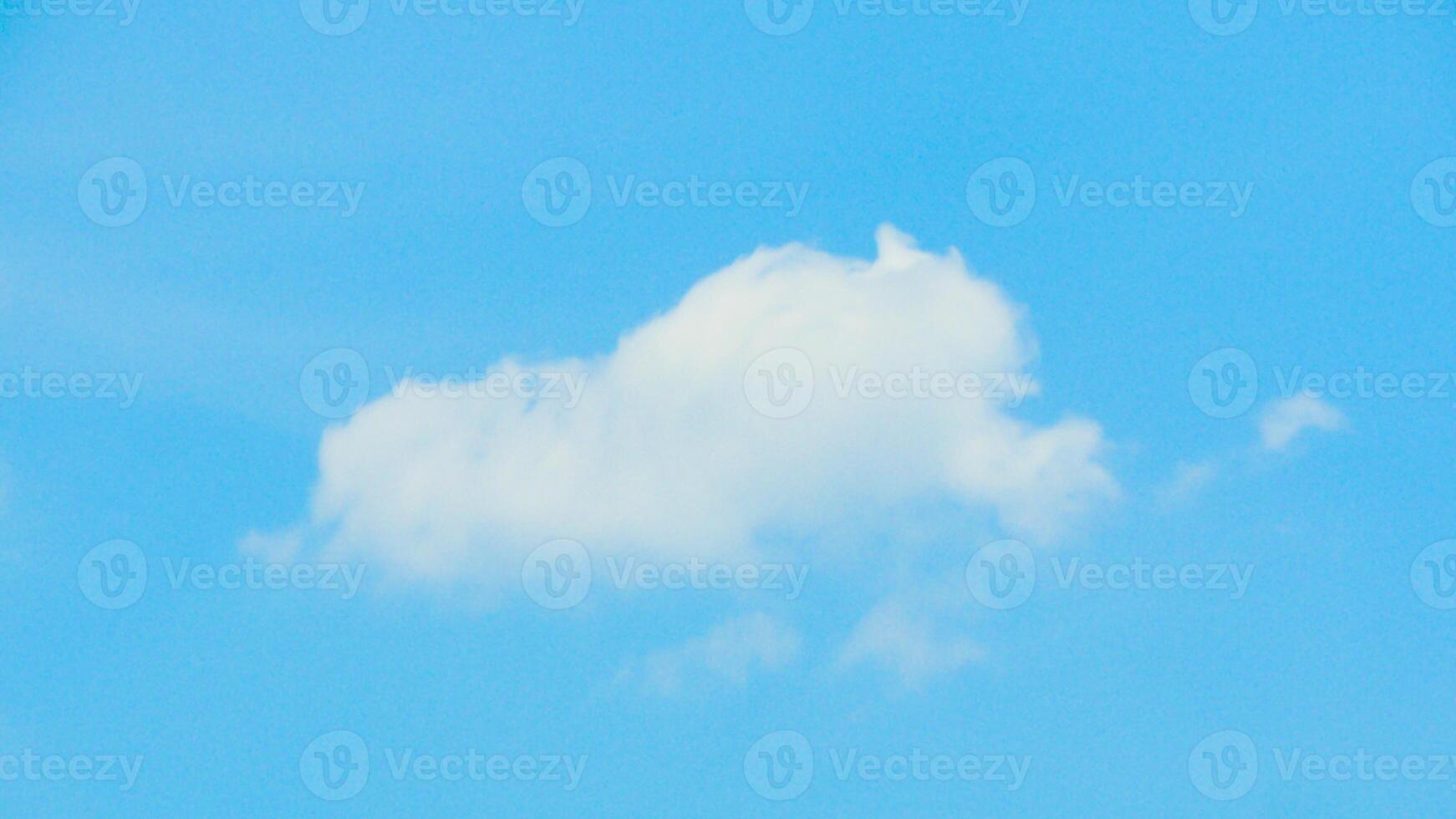 A plane flying in the sky with a cloud in the background photo