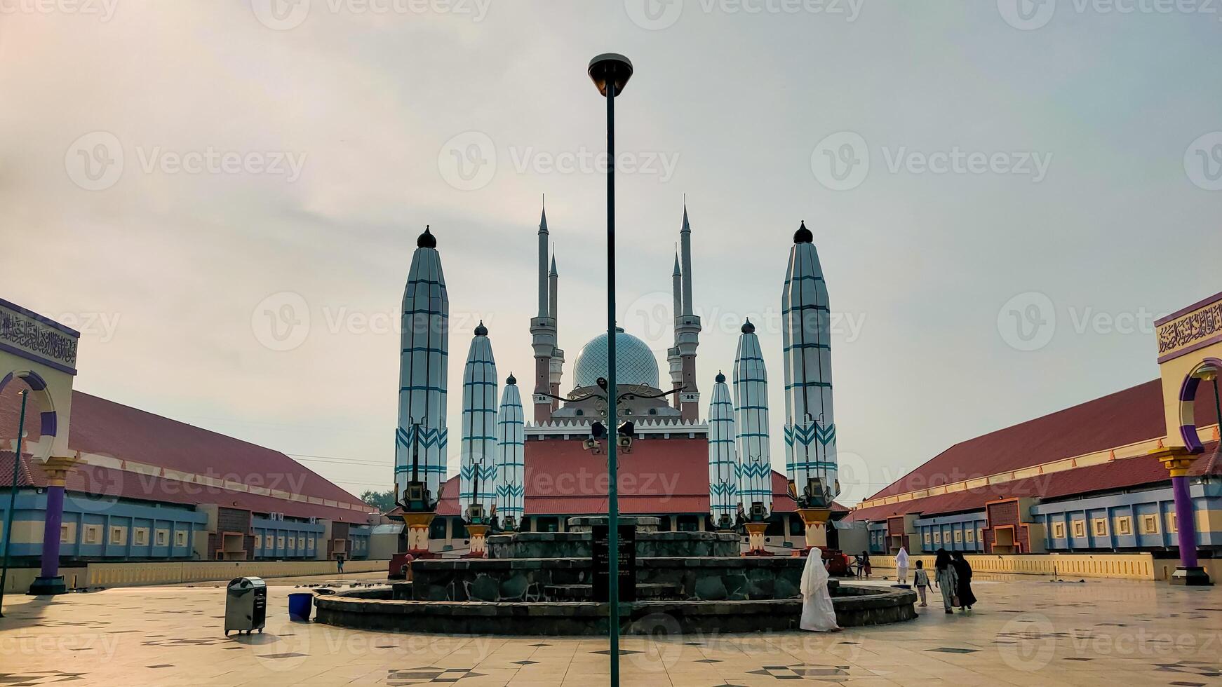 The mosque is in the middle of a courtyard photo