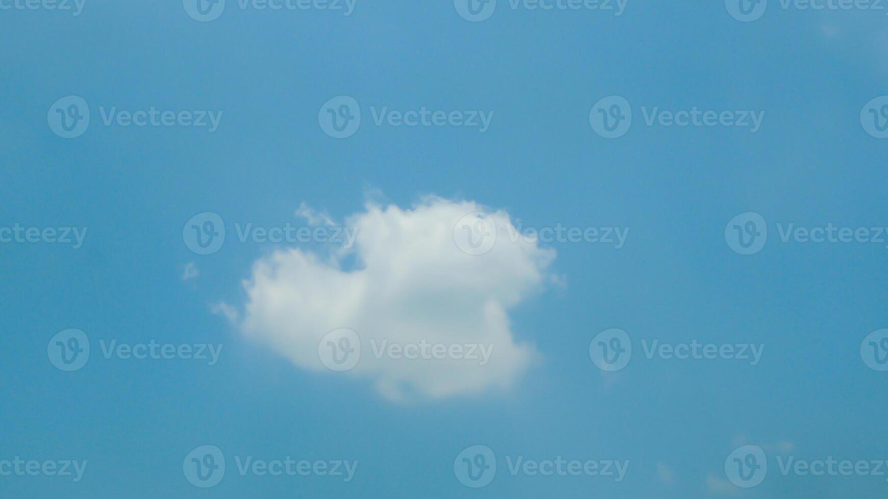 A plane flying in the sky with a cloud in the background photo