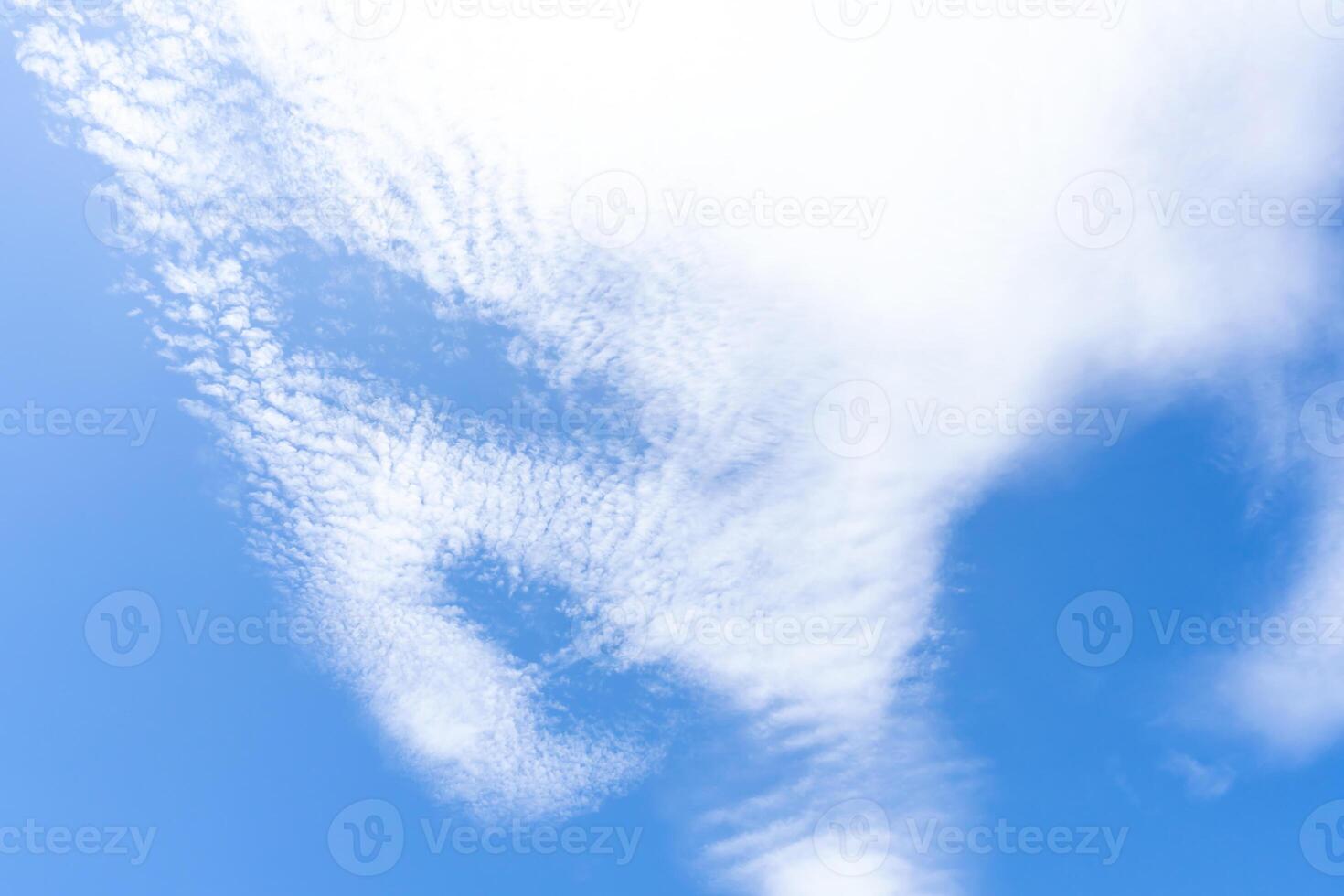 Low angle view and full frame of beautiful blue sky with strange shape of clouds in the morning or evening in sunny day used as natural background texture in decorative art work photo