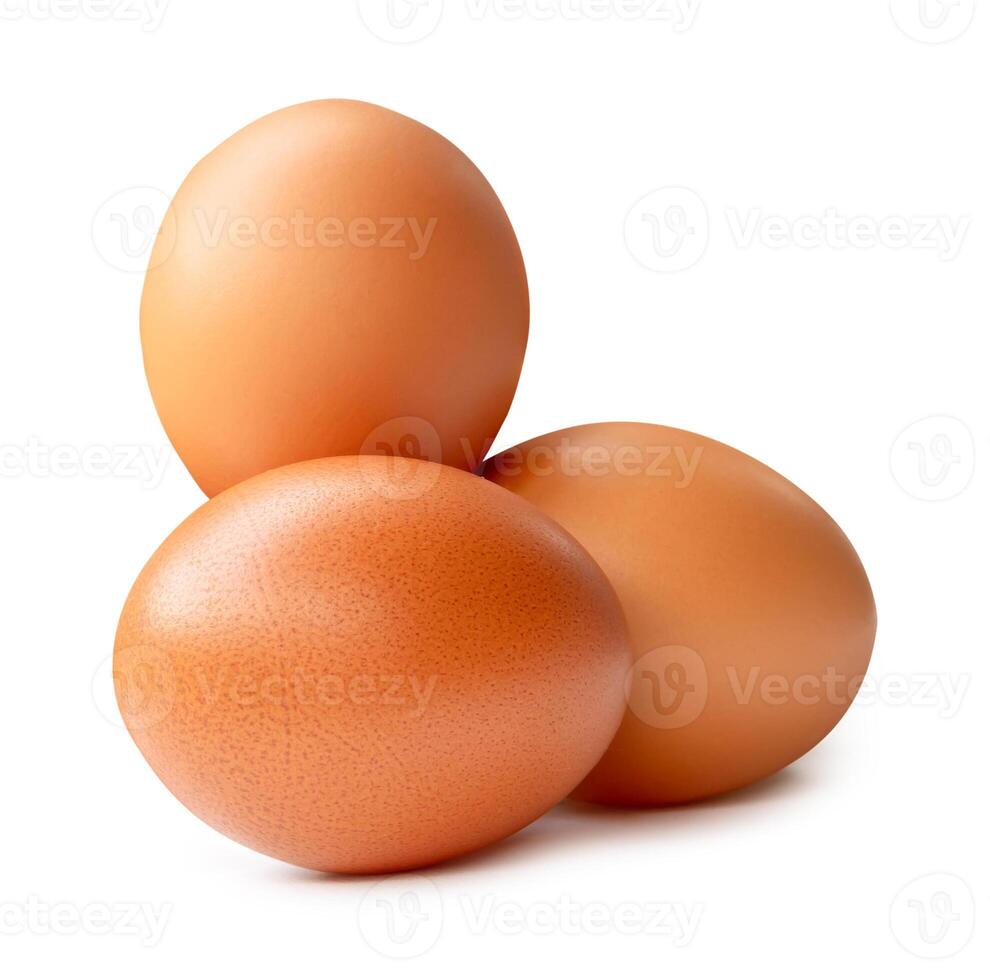 Side view of three brown chicken eggs in stack isolated on white background with clipping path photo