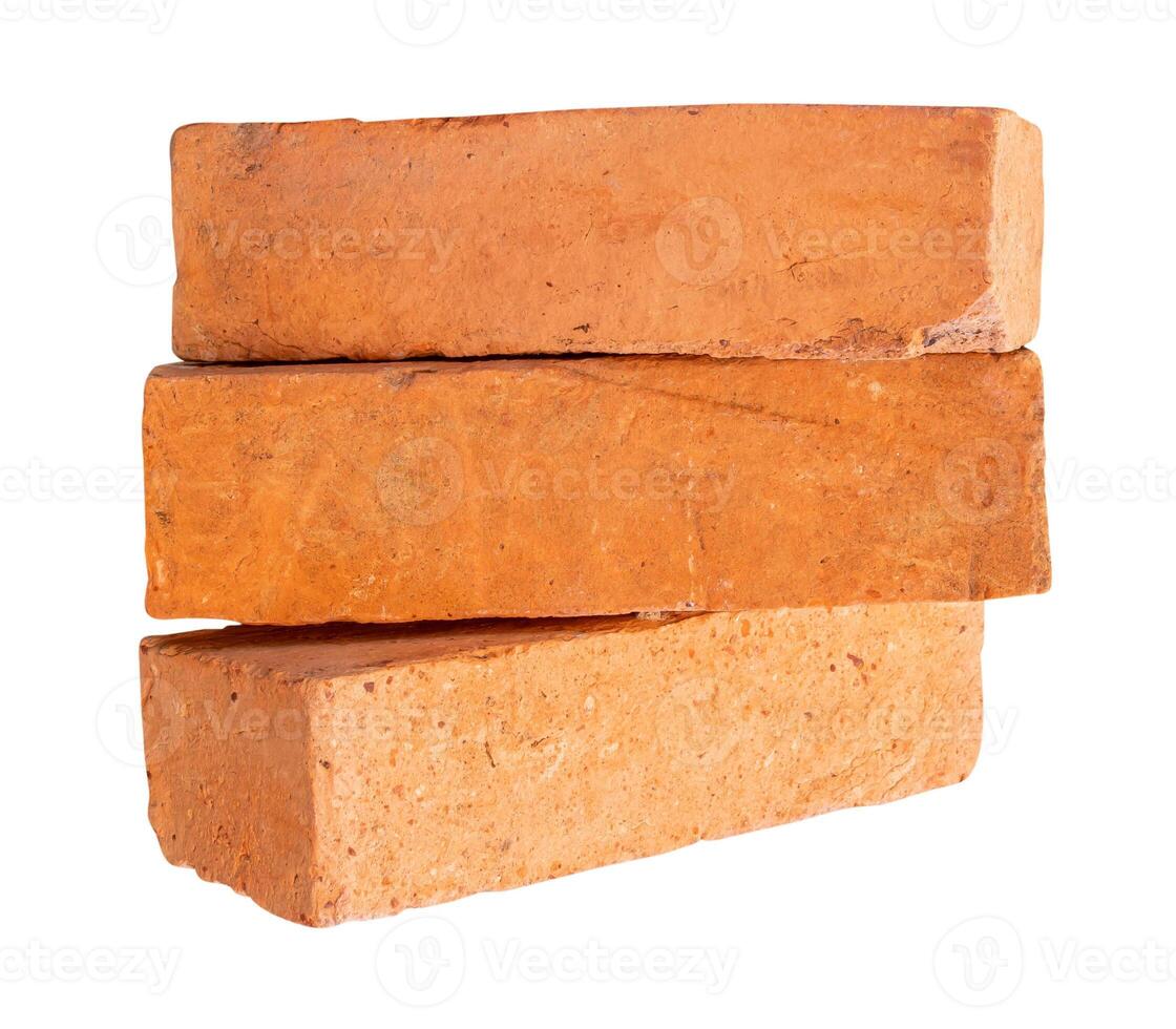 Side view of old red or orange bricks in stack isolated on white background with clipping path photo