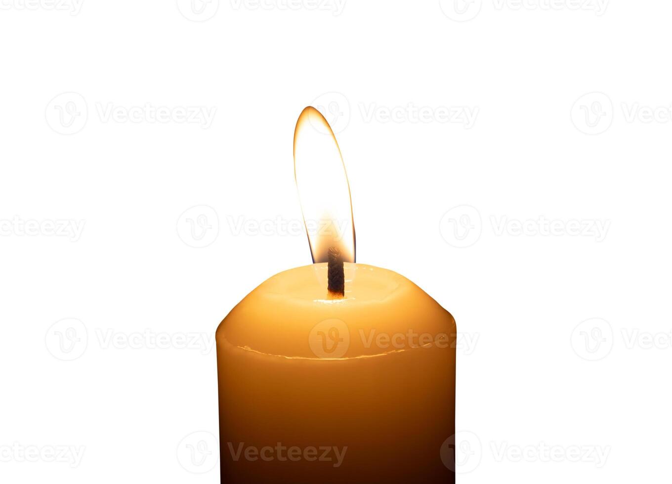 A single burning candle flame or light glowing on a big white candle isolated on white background with clipping path photo