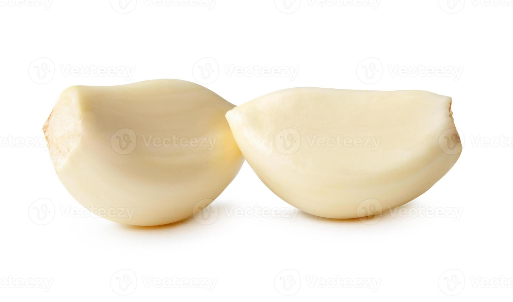 Side view of peeled garlic cloves in stack isolated on white background with clipping path photo