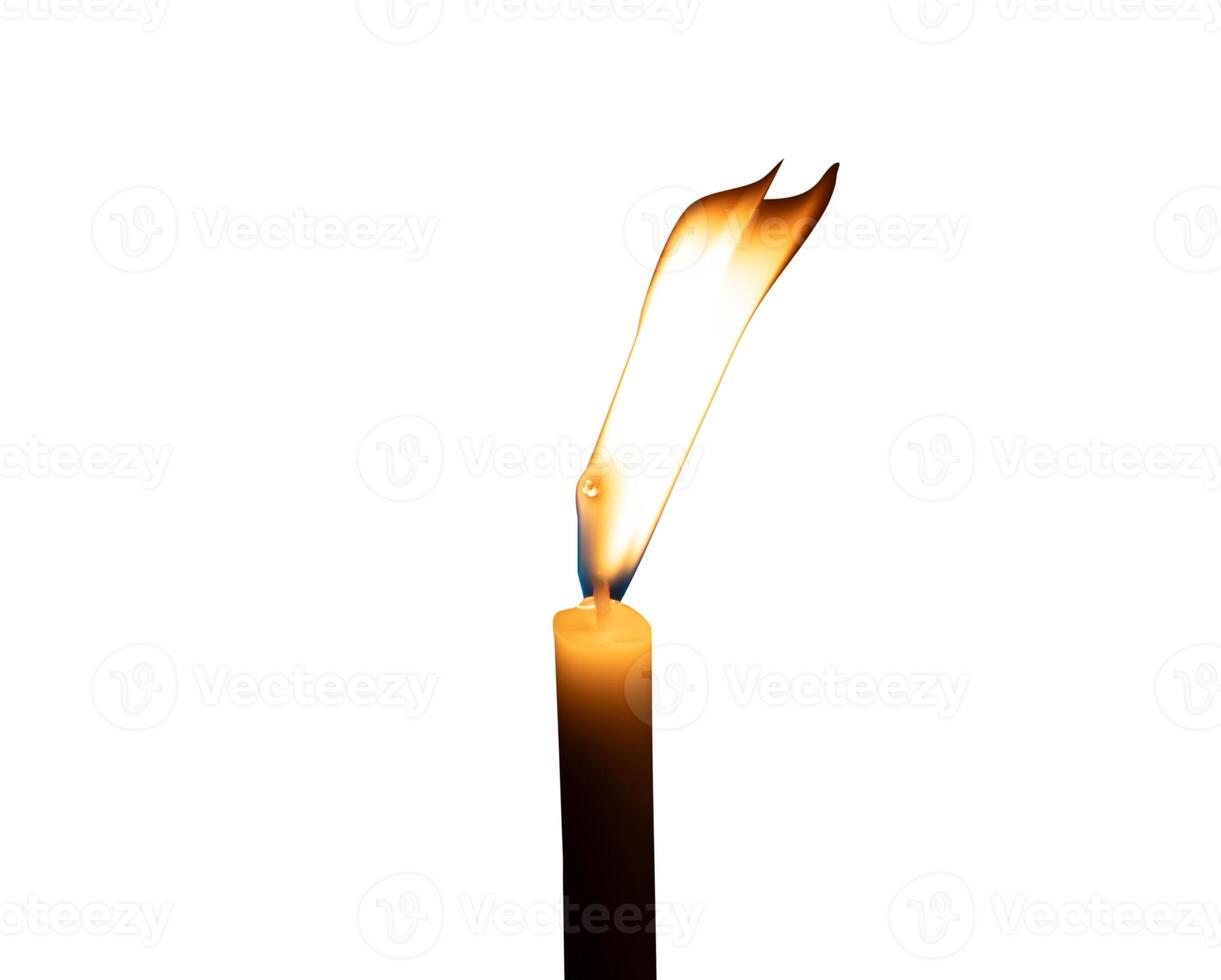 A single burning candle flame or light glowing on a small white candle isolated on white background with clipping path photo