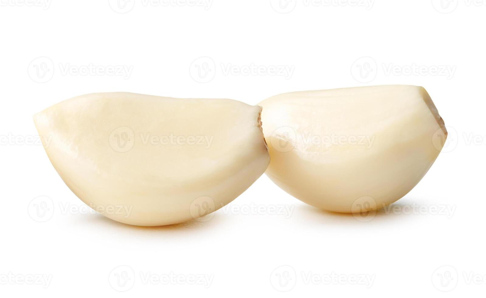 Side view of peeled garlic cloves in stack isolated on white background with clipping path photo