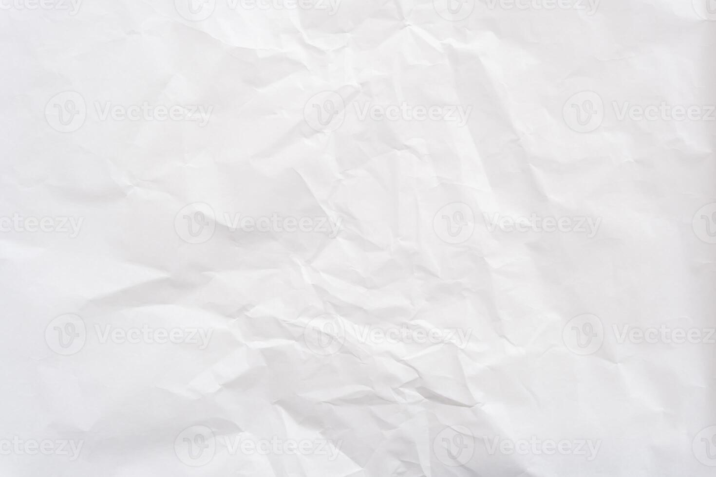 Top view and full frame of wrinkled or crumpled white stencil paper texture used for wrinkled or crumpled white paper background texture in decorative art work photo