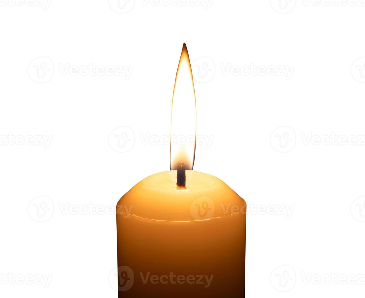 A single burning candle flame or light glowing on a big white candle isolated on white background with clipping path photo