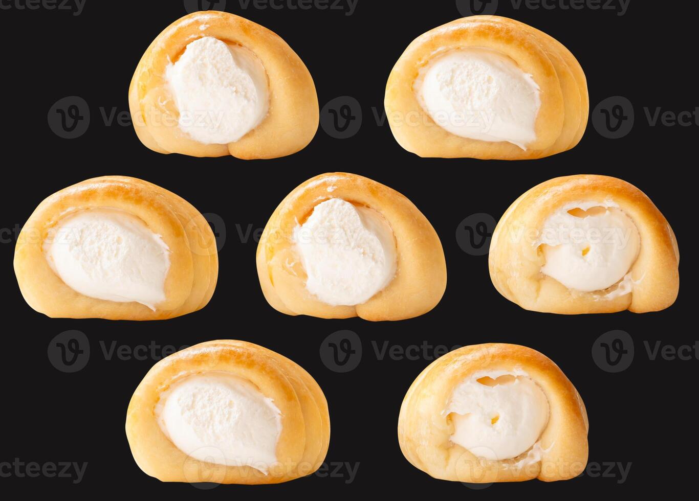 Top view set of puff pastry cream horns isolated on black background with clipping path photo