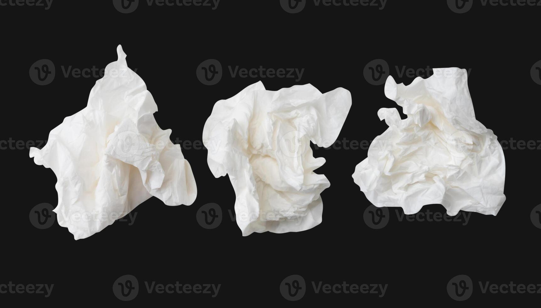 Top view set of screwed or crumpled white tissue paper ball isolated on black background with clipping path photo