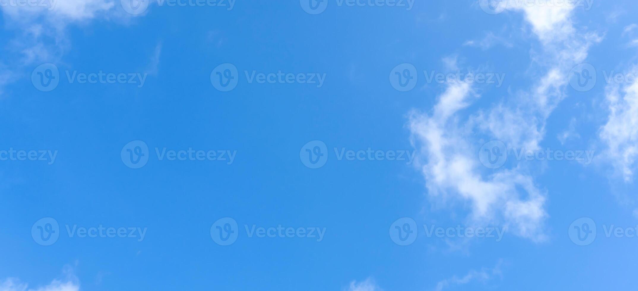 Low angle view of beautiful blue sky with strange shape of clouds in the morning or evening used as natural background texture in decorative art work. photo
