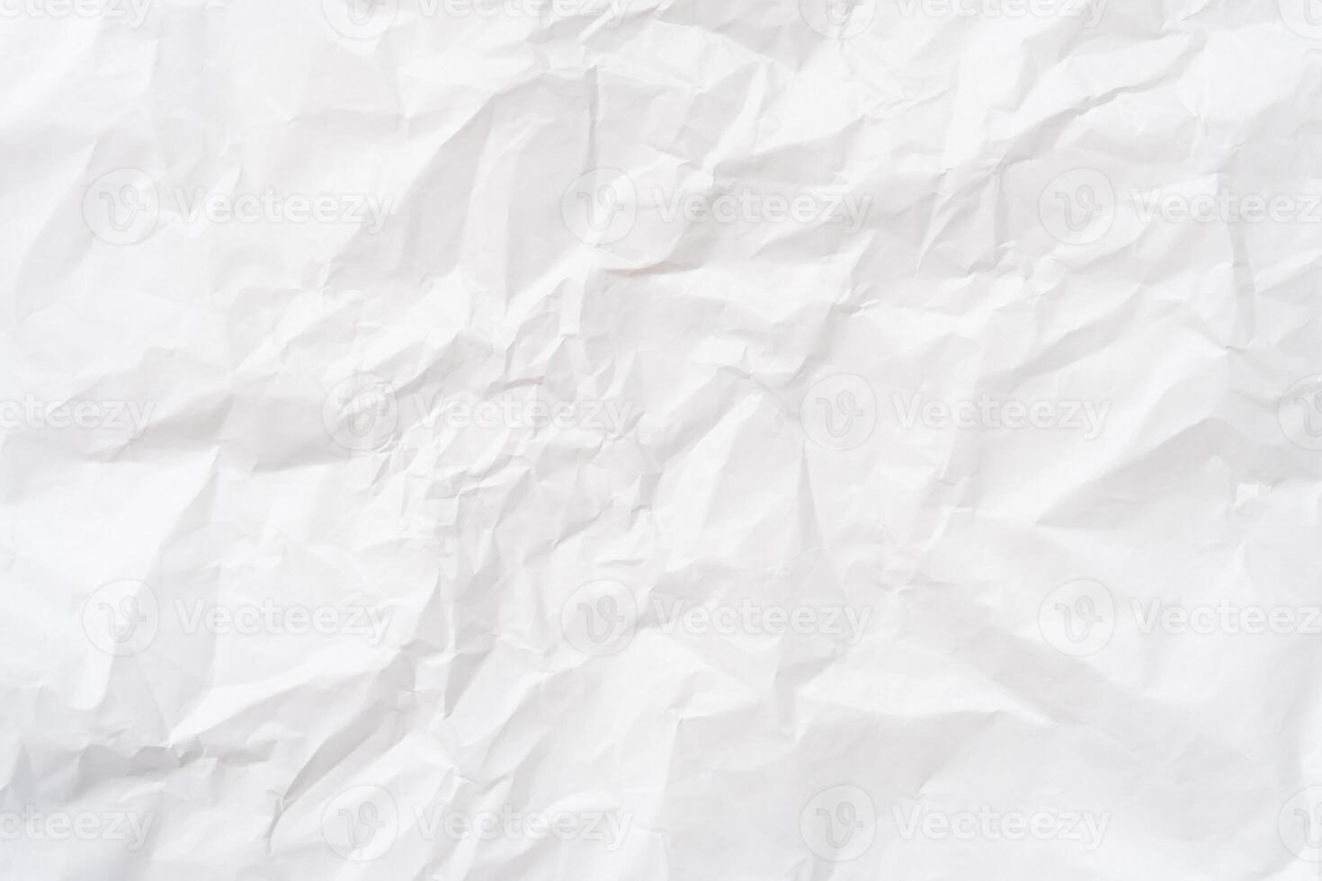 Top view and full frame of wrinkled or crumpled white stencil paper texture used for wrinkled or crumpled white paper background texture in decorative art work photo