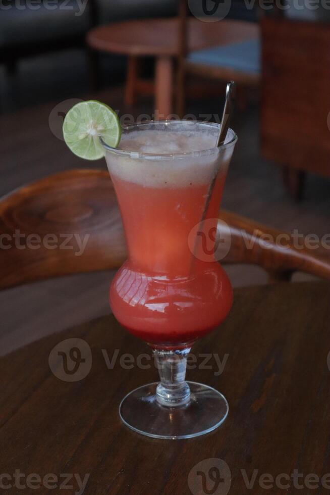 Non-Alcoholic Fresh cocktail on brown table with lemon fruit. fresh drink at the summer outside cofe shop photo