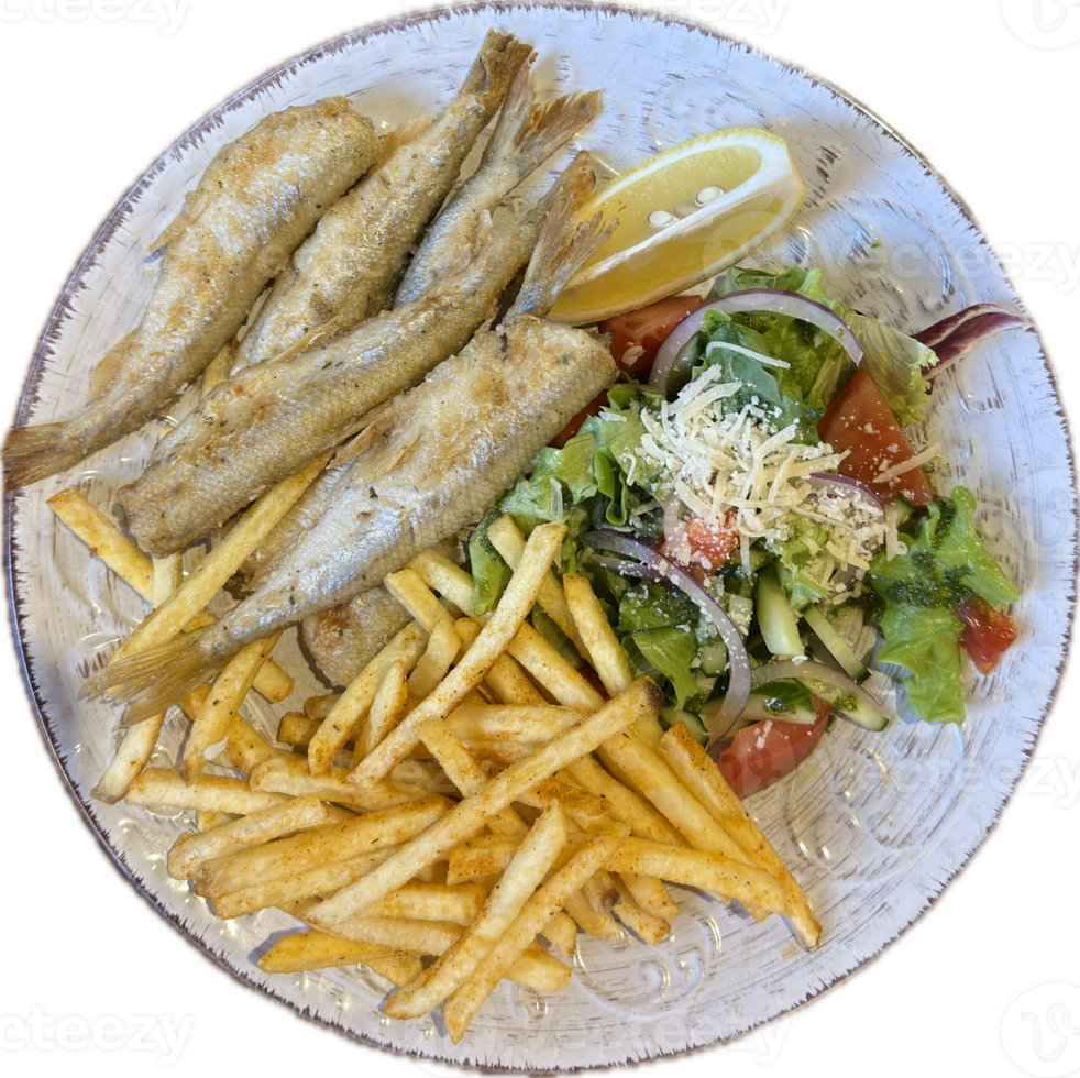 A plate of crispy fried smelt fish served with seasoned French fries, fresh vegetable salad, and a slice of lemon. png