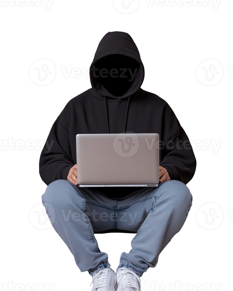 Mysterious figure in black hoodie using laptop on transparent background png