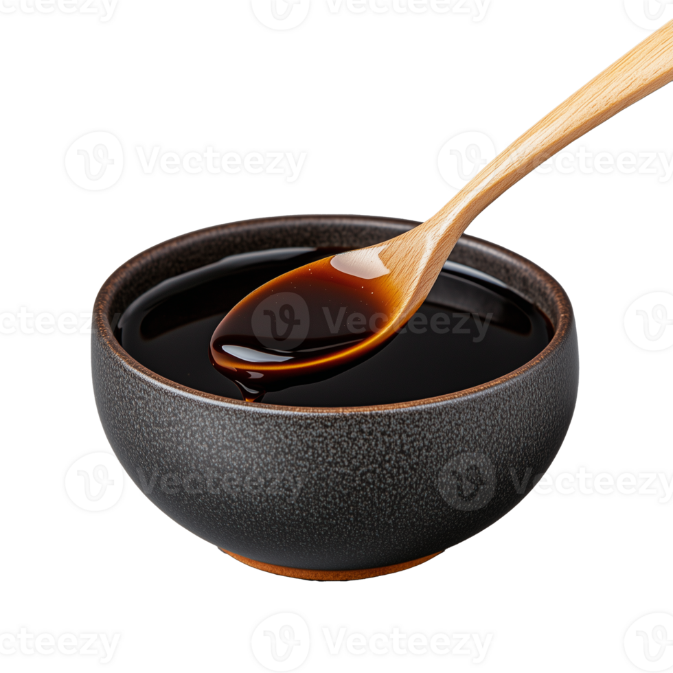 Dark soy sauce in a bowl with wooden spoon on transparent background png