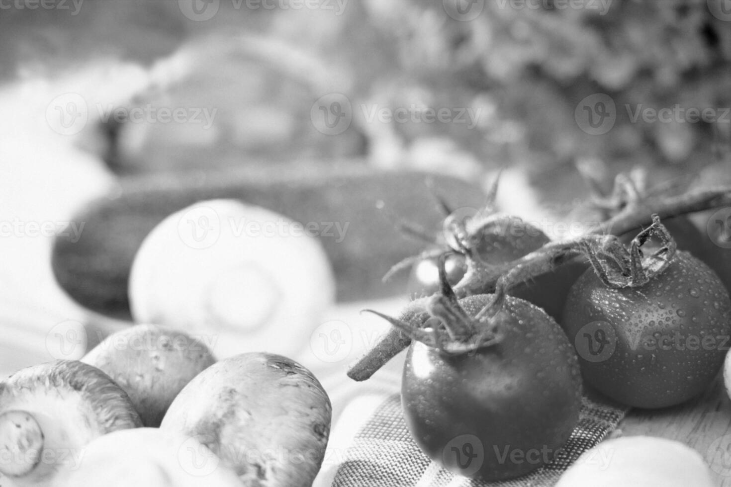 Fresh and Flavorful Cherry and Plum Tomatoes Served on Elegant Tableware photo