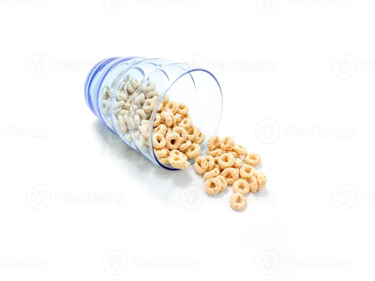 Isolated of cereal pour from the blue glass photo